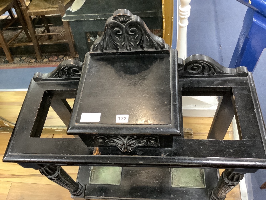 A late Victorian ebonised oak hallstand carved in Flemish style, length 77cm, depth 32cm, height 100cm